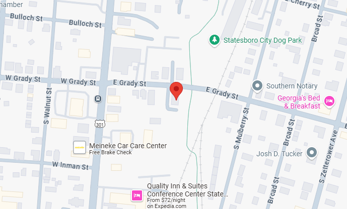 Map showing Statesboro, Georgia with streets labeled, including E Grady St and S Walnut St. Points of interest include Meineke Car Care Center, Georgia's Bed & Breakfast, and Statesboro City Dog Park. A red location pin marks a specific spot.